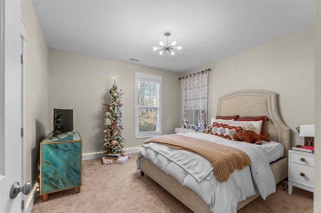 carpeted bedroom featuring baseboards, visible vents, and an inviting chandelier