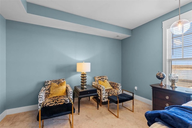 sitting room with light carpet and baseboards