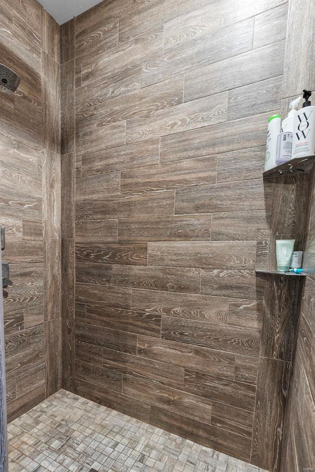 bathroom with tiled shower