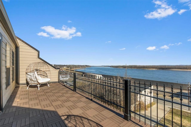 view of patio / terrace featuring a water view and a balcony