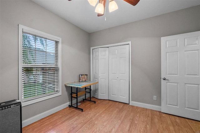 interior space featuring light hardwood / wood-style flooring, a closet, and ceiling fan