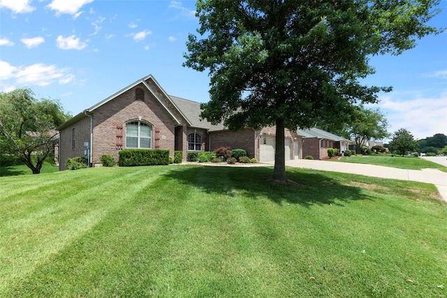 view of front of home featuring a garage and a front yard