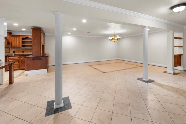 basement featuring a chandelier, ornamental molding, and light tile patterned floors