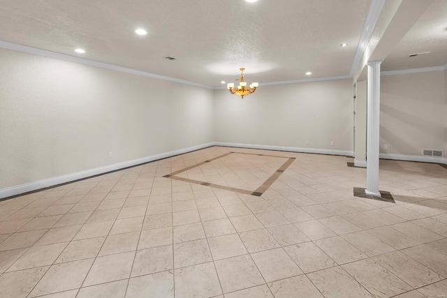 basement with ornamental molding, light tile patterned flooring, an inviting chandelier, and a textured ceiling