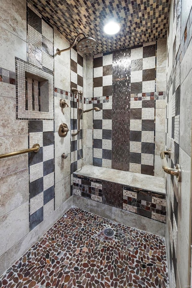 bathroom with tiled shower