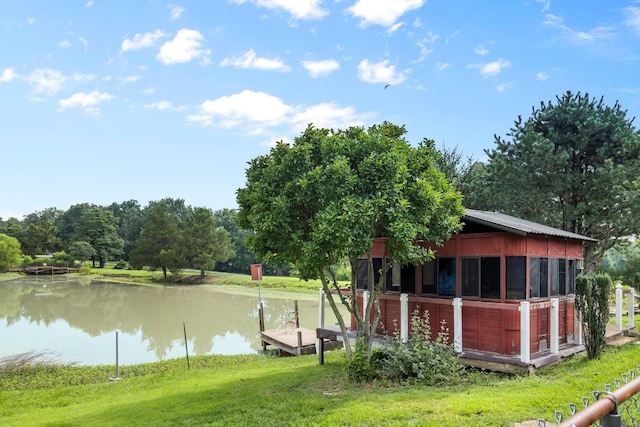 exterior space with a yard and a water view