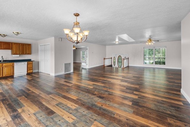 unfurnished living room featuring a textured ceiling, sink, ceiling fan with notable chandelier, and hardwood / wood-style flooring