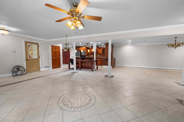 interior space featuring ornamental molding, light tile patterned floors, and ceiling fan