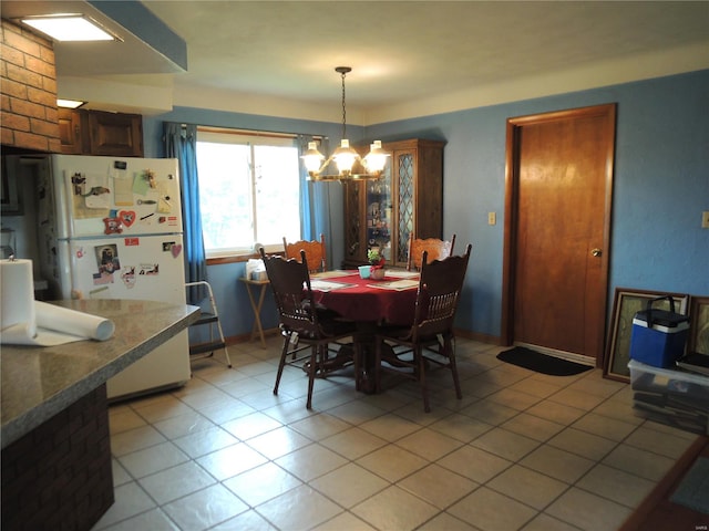 dining area with an inviting chandelier