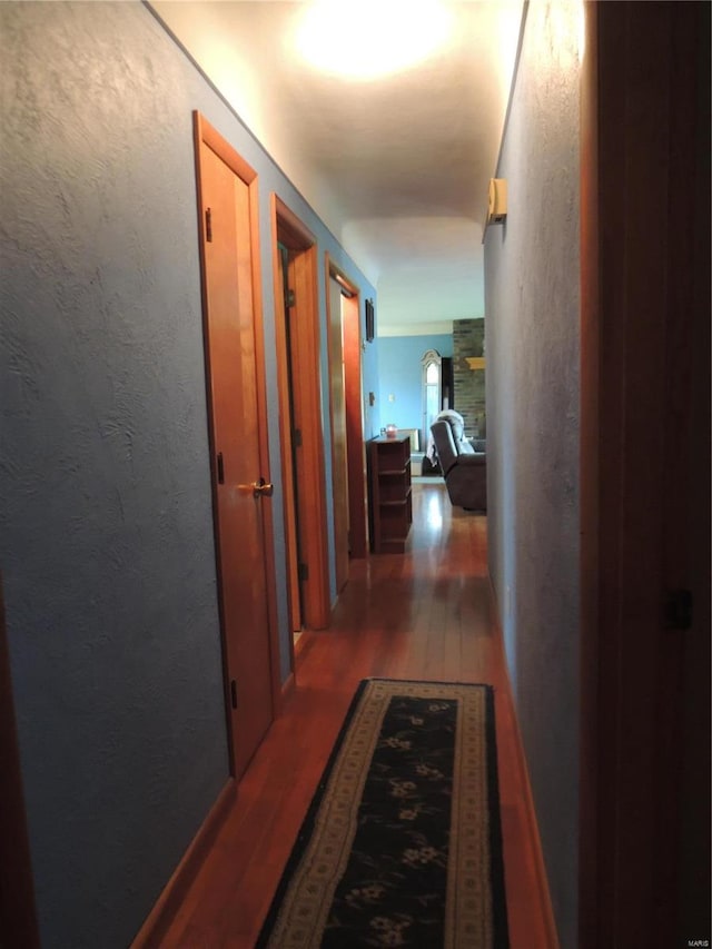 hall featuring dark wood-type flooring