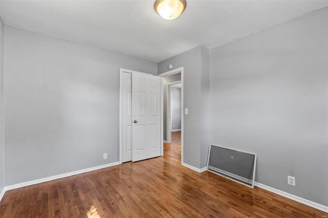 empty room featuring hardwood / wood-style floors