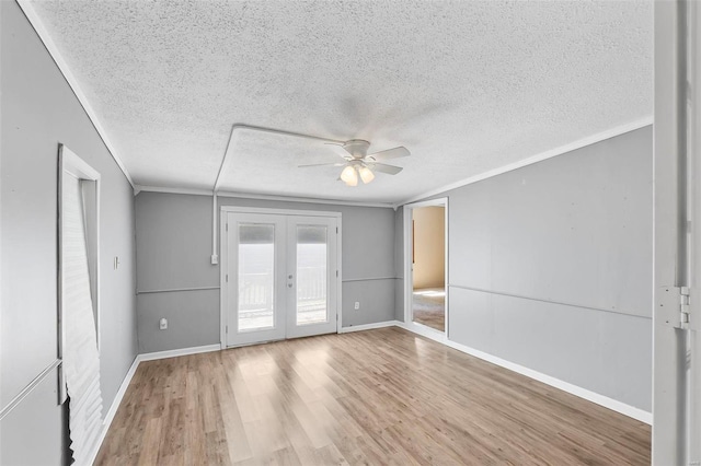 unfurnished room with french doors, ceiling fan, ornamental molding, and wood-type flooring