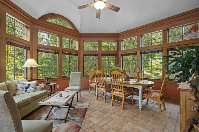 sunroom / solarium featuring vaulted ceiling and ceiling fan