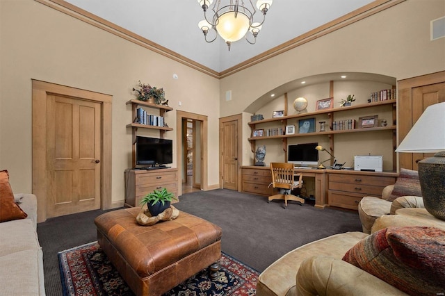 carpeted living room featuring ornamental molding, built in desk, a chandelier, and a high ceiling