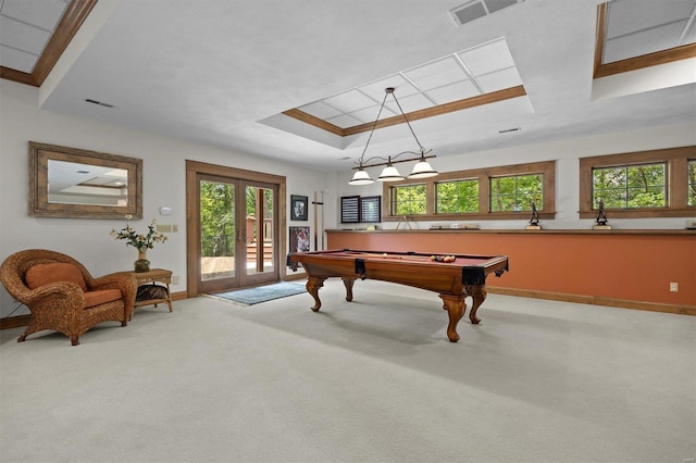 rec room featuring light colored carpet, billiards, and a raised ceiling