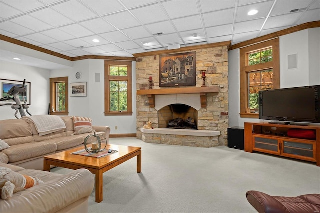 carpeted living room featuring a paneled ceiling, a fireplace, and ornamental molding