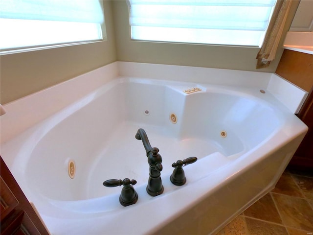 bathroom featuring tile patterned floors and a bathing tub