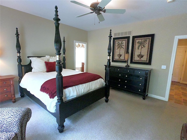 bedroom featuring light carpet and ceiling fan