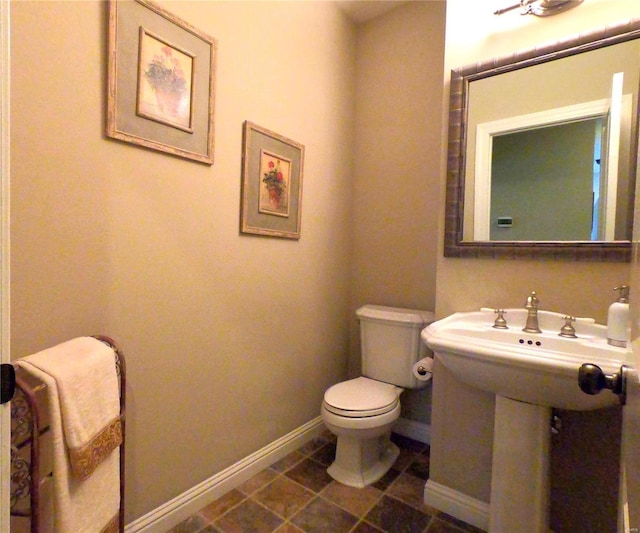 bathroom featuring tile patterned floors and toilet