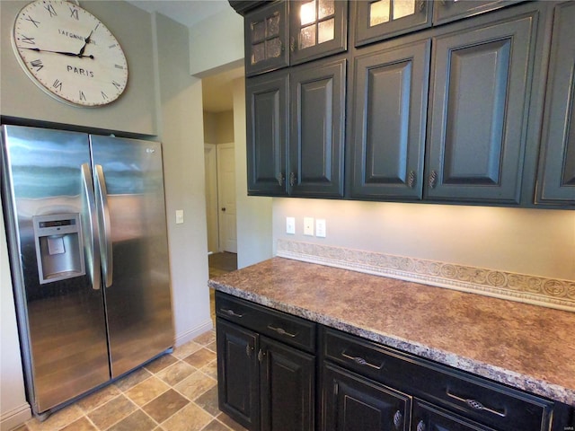 kitchen with stainless steel refrigerator with ice dispenser