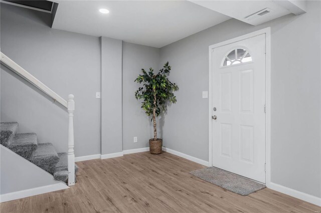 foyer entrance with light wood-type flooring