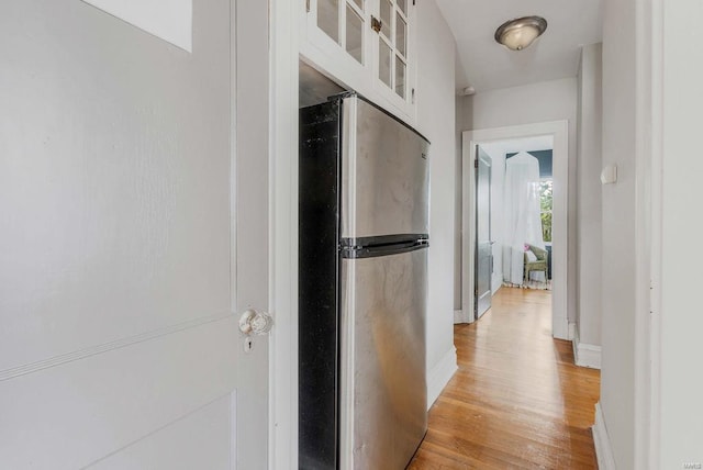 hall with light hardwood / wood-style floors