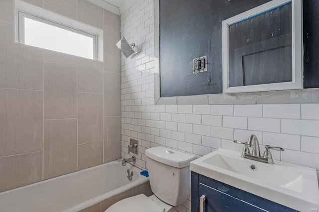 full bathroom with vanity, tile walls, and toilet