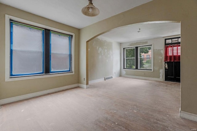 empty room with hardwood / wood-style floors