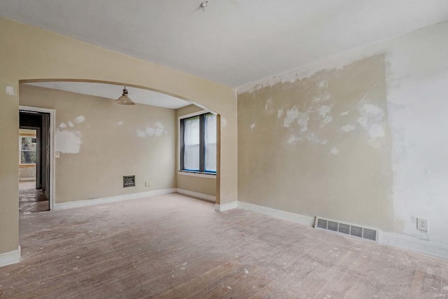 empty room featuring hardwood / wood-style flooring