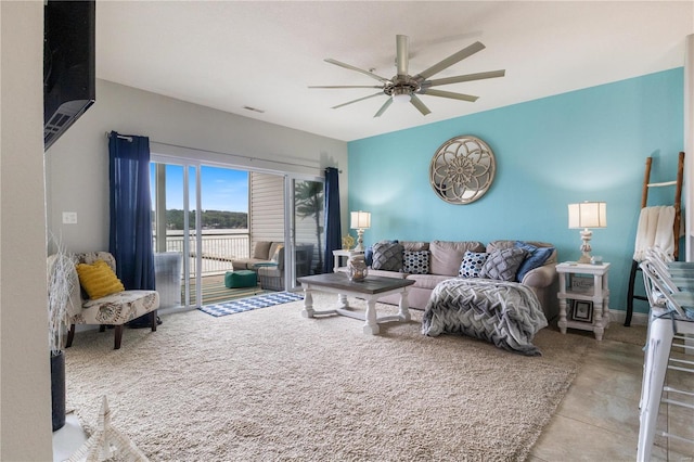 tiled living room featuring ceiling fan