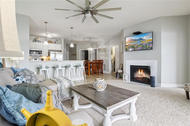 living room with light carpet and ceiling fan