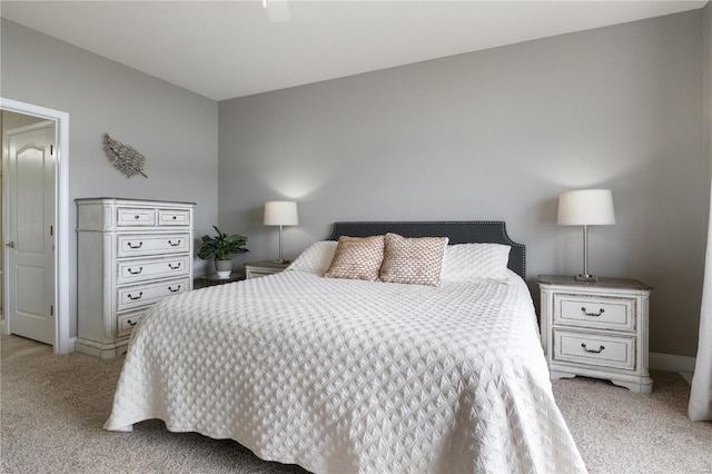 bedroom featuring light colored carpet and ceiling fan