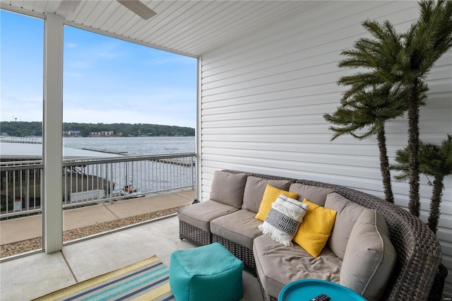 exterior space featuring a water view and outdoor lounge area