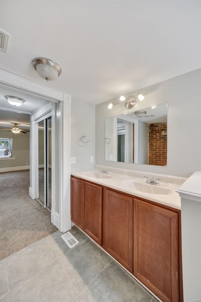 bathroom with ceiling fan, vanity, and tile patterned flooring