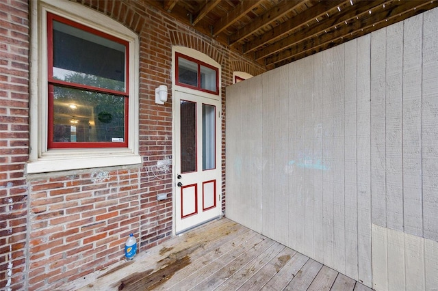 doorway to property featuring a deck