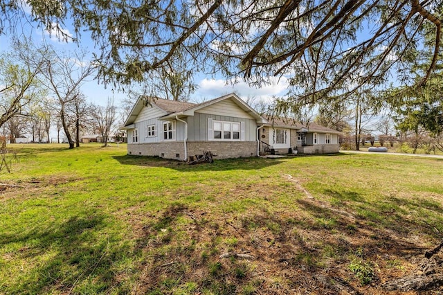 view of home's exterior with a lawn