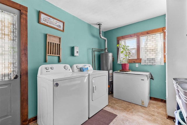 laundry room with separate washer and dryer, gas water heater, and light tile patterned floors