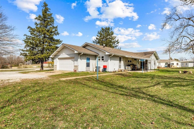 view of front of home with a garage and a front yard