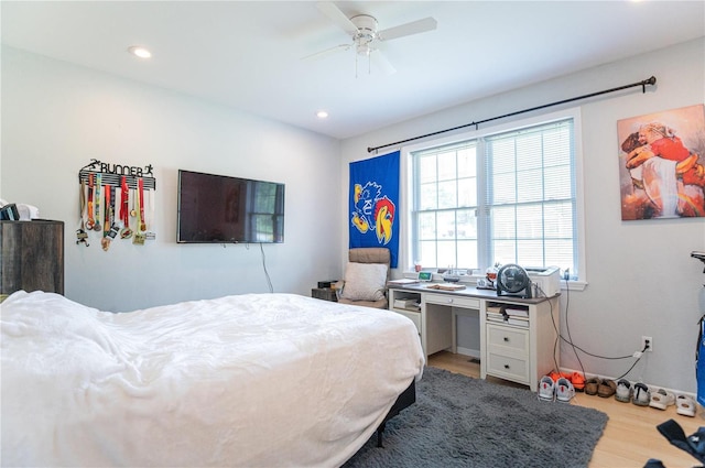 bedroom featuring wood-type flooring and ceiling fan