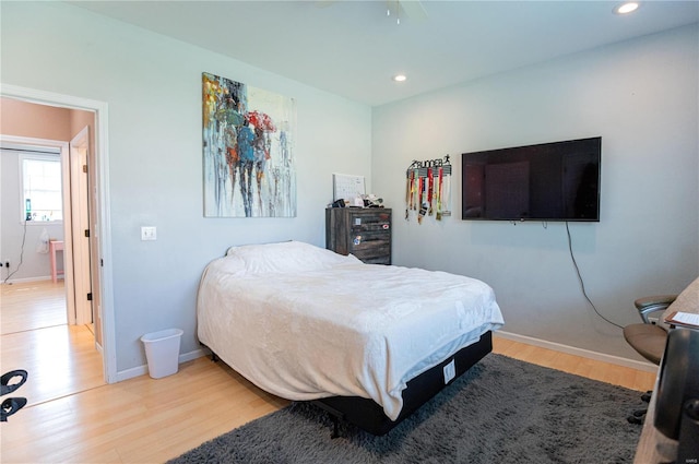 bedroom with hardwood / wood-style floors