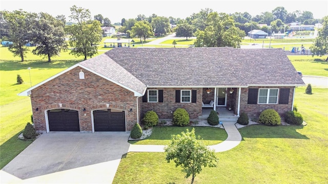 view of front of house featuring a garage and a front yard