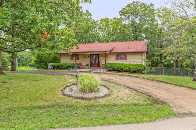 ranch-style home with a front yard