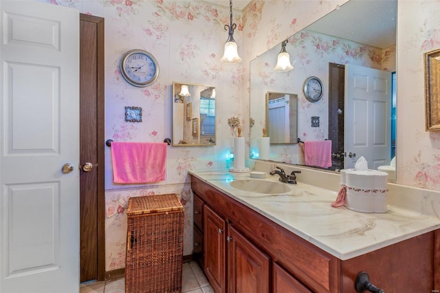 bathroom featuring tile patterned flooring and vanity