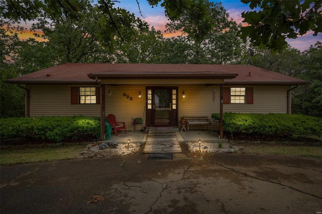 single story home with covered porch