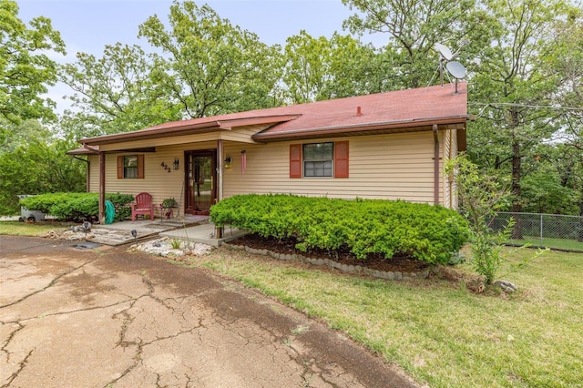 ranch-style house with a front yard