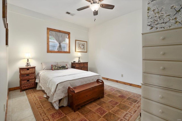 bedroom with light tile patterned floors, visible vents, ceiling fan, and baseboards
