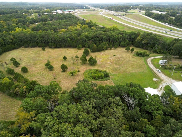 birds eye view of property featuring a rural view