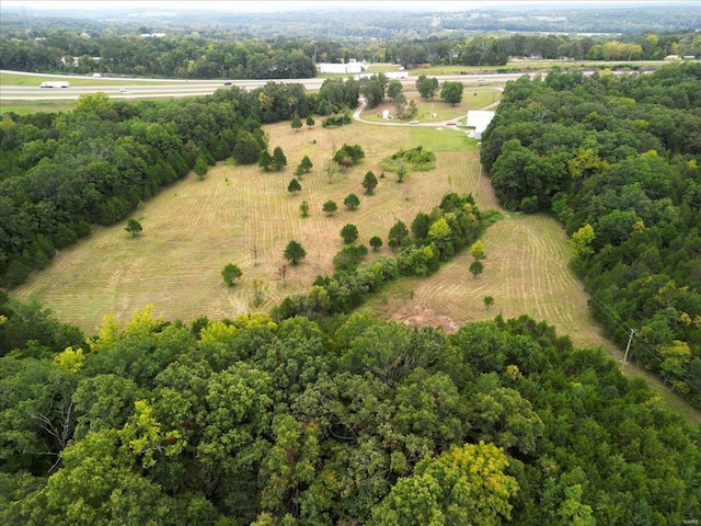 birds eye view of property with a rural view