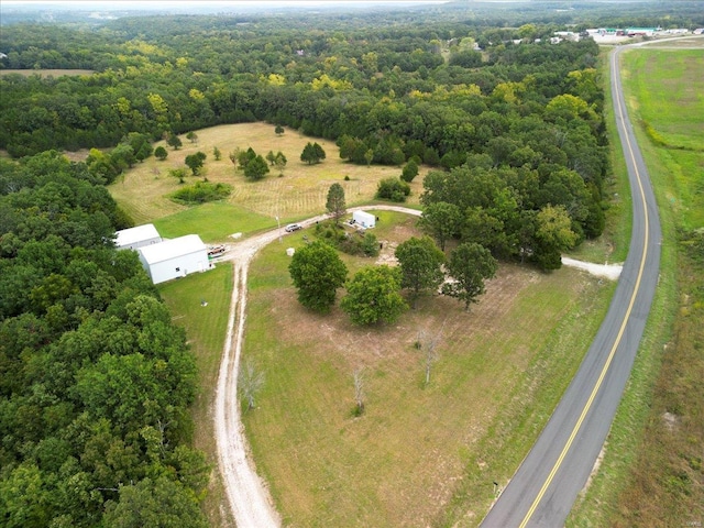 birds eye view of property featuring a rural view