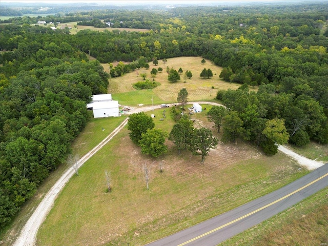 bird's eye view with a view of trees and a rural view